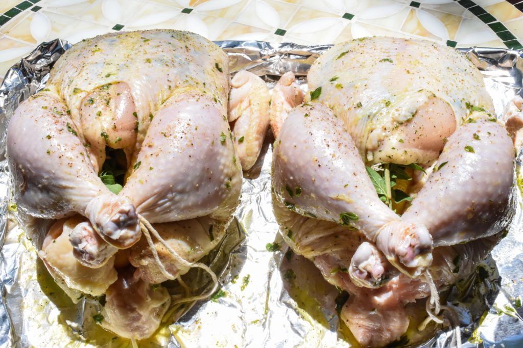 Whole chickens prepped to smoke