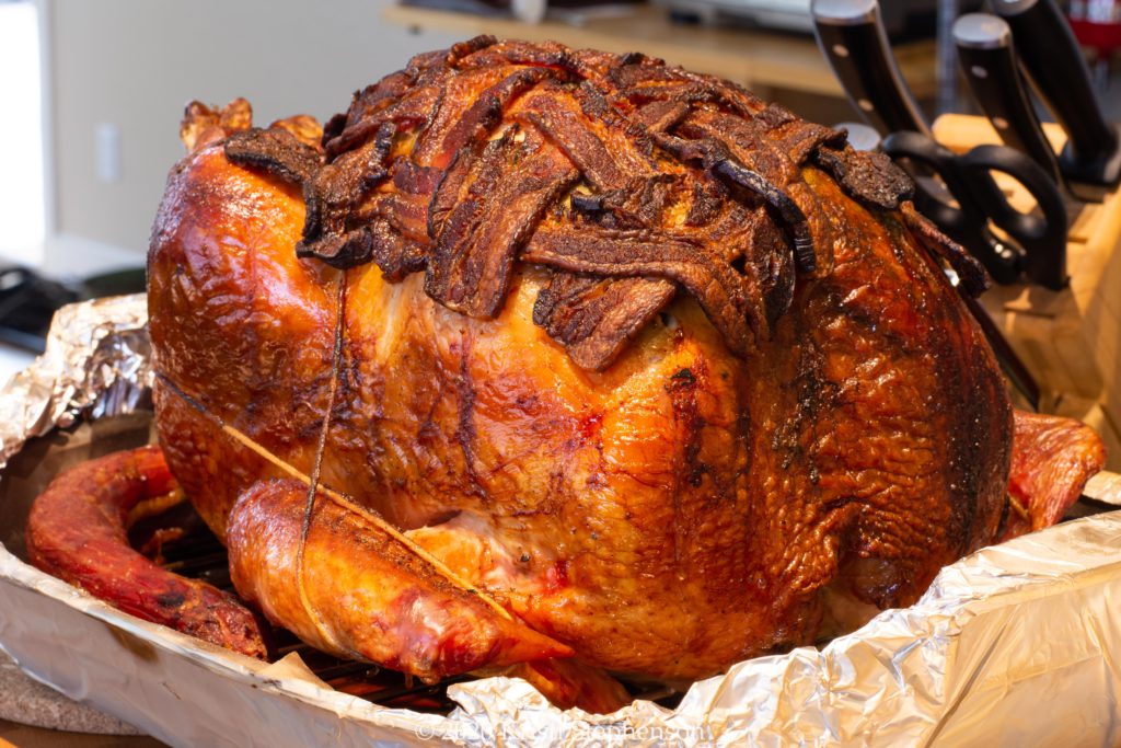 Whole smoked turkey, bacon wrapped