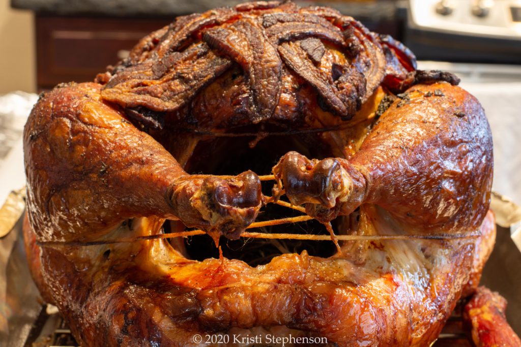 Whole smoked turkey, drumstick angle